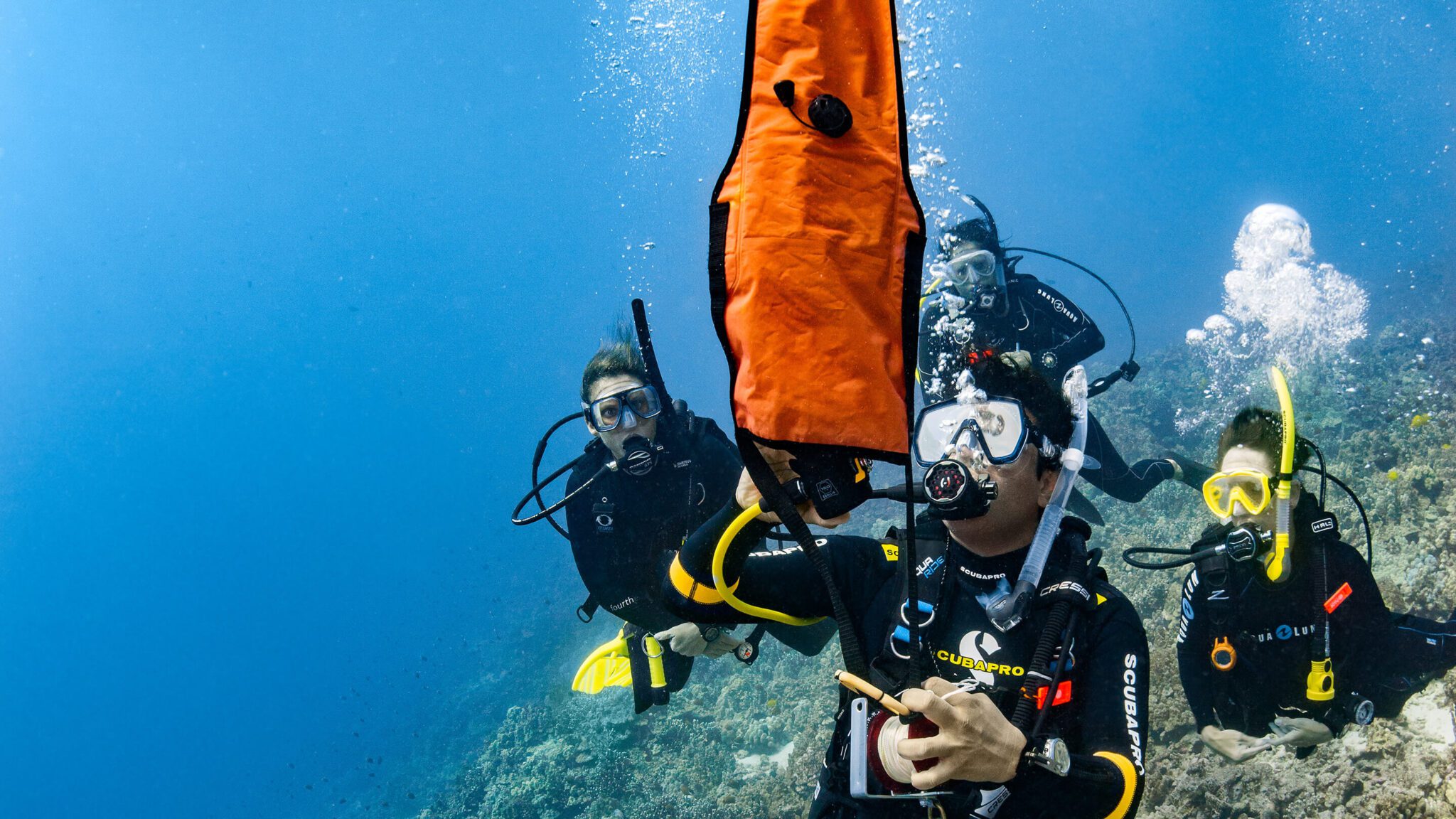 adventure diver deploying a DSMB