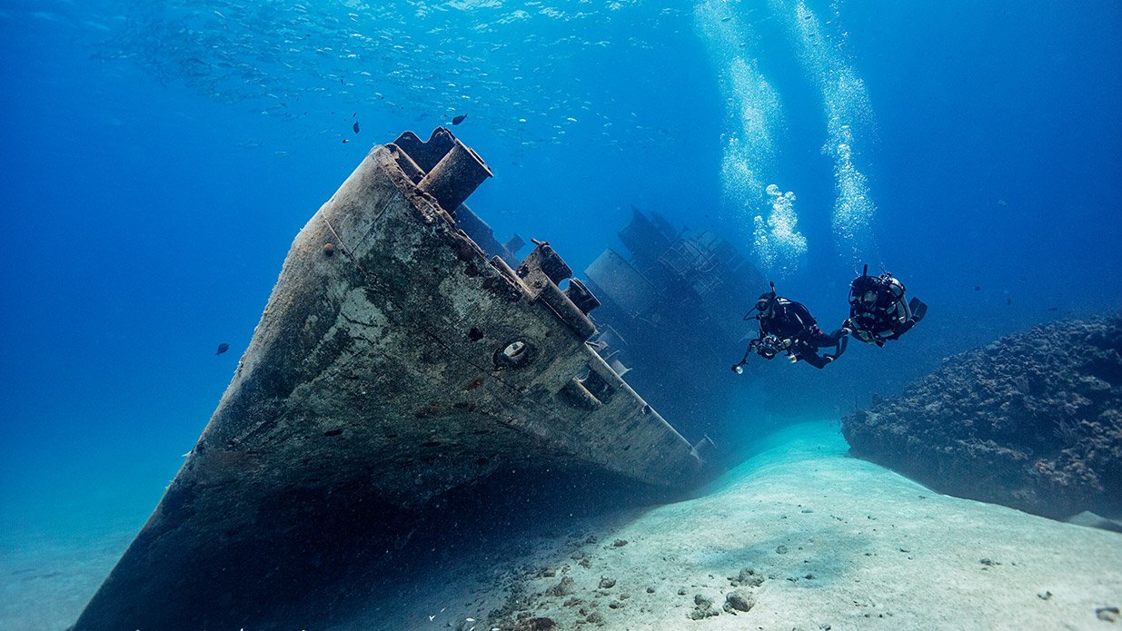 advanced open water divers on a wreck dive