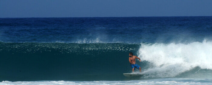 man surfing in lagkouvardos beach in messenia