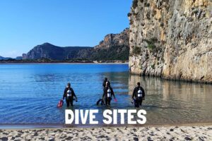 Scuba divers entering in one of our diving sites.